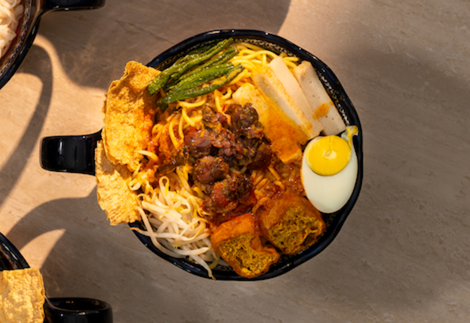 Klang curry noodles with tofu puffs, long beans and a half-boiled egg