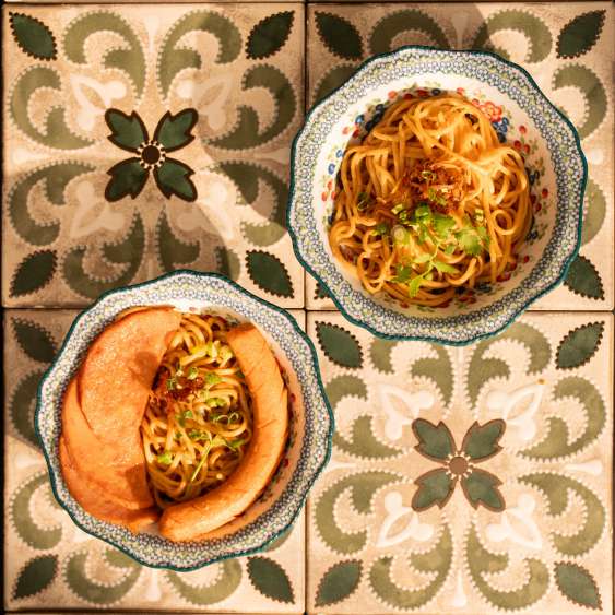 Noodles and roti on heritage floral tiles