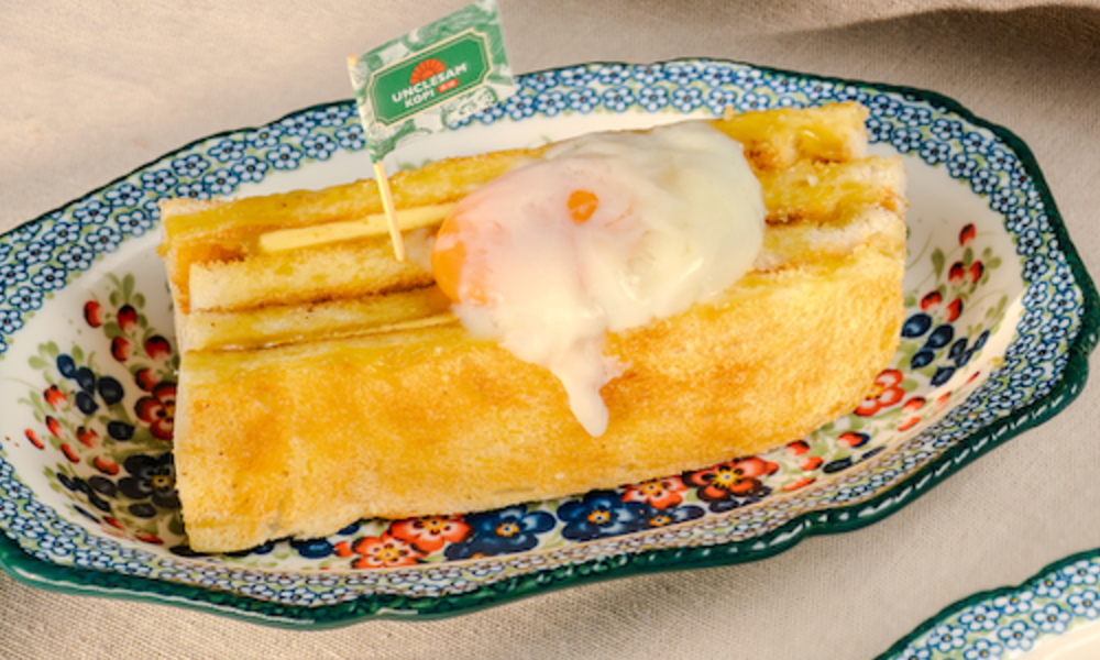 Charcoal roti bakar topped with a soft half-boiled egg