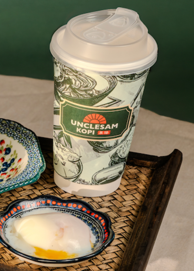 UncleSam Kopi cup with a half-boiled egg on a rattan tray
